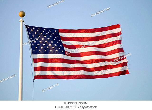 American flag blows in the wind by the ocean in Newport, Rhode Island