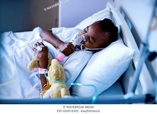 Patient wearing oxygen mask while sleeping