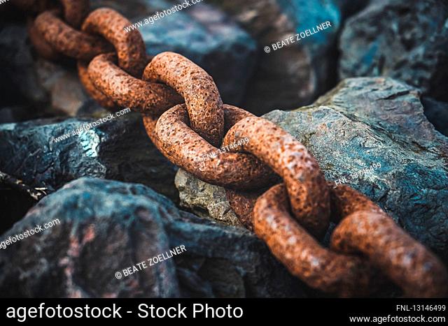 Rusted chain calbe at river bank of river Elbe, near Hohnsdorf, Lower Saxony, Germany, Europe