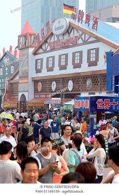 People crowd into the festival grounds during 24th Oktoberfest in Qingdao, China, 16 August 2014. According to organizers