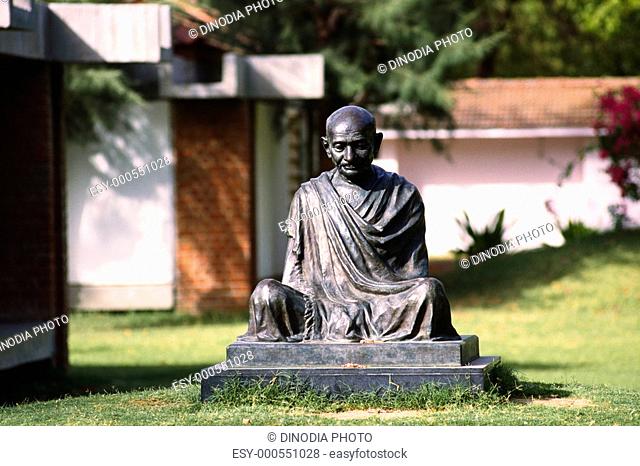 Statue of Gandhi in Gandhi museum complex , Ahmedabad , Gujarat , India