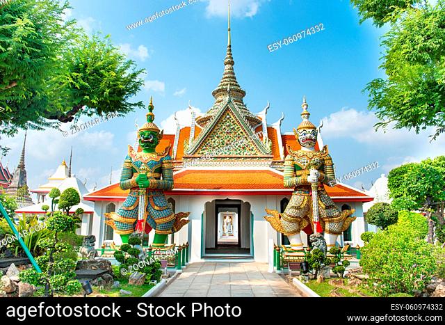 Gates to Ordination Hall with statues of Giants, demon guardians. Wat Arun temple, Bangkok, Thailand