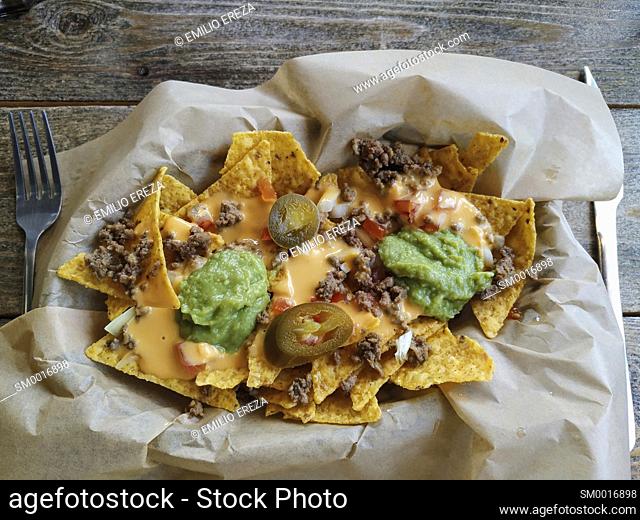 Nachos with guacamole and meat