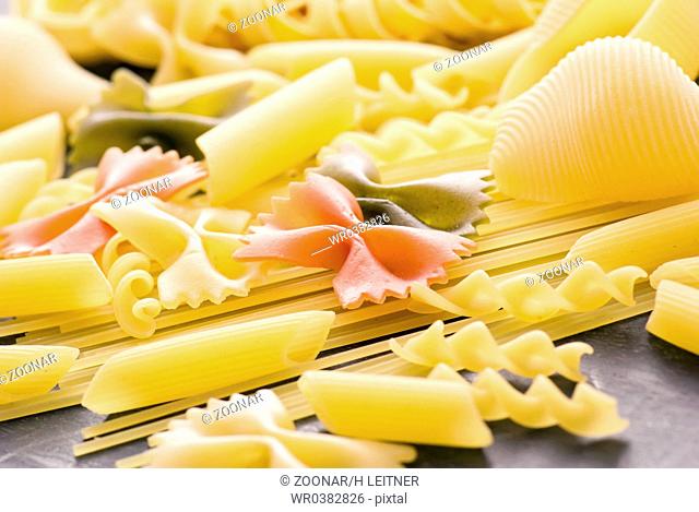 Collection of different Italian pasta as closeup on wood