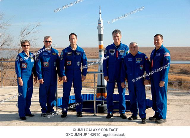 At the Cosmonaut Hotel crew quarters in Baikonur, Kazakhstan, the Expedition 50-51 prime and backup crewmembers pose for pictures Nov