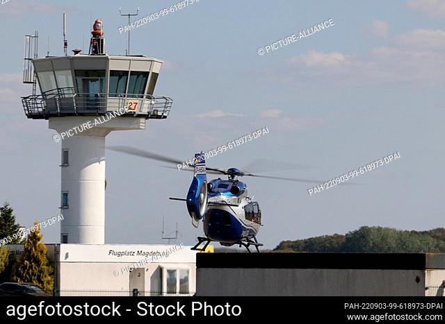 03 September 2022, Saxony-Anhalt, Magdeburg: A police helicopter takes off from Magdeburg airfield and flies toward the Harz Mountains