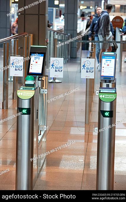 05 April 2023, Hamburg: Signs reading Slot &Fly can be seen at passageways at Hamburg Airport. Hamburg Airport introduced new ""Slot & Fly"" service