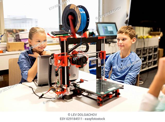 education, children, technology, science and people concept - group of happy kids with 3d printer and laptop computer at robotics school lesson
