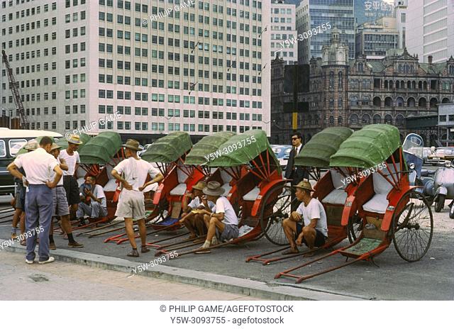 Rickshaw pullers waiting at a rank in Hong Kong, 1966