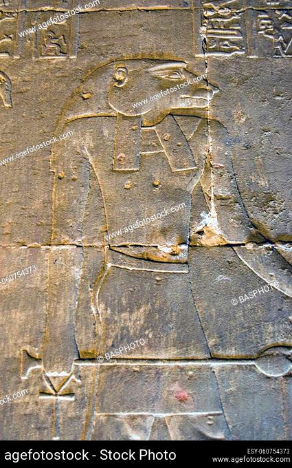 Ancient Egyptian hieroglyphic carving of the baboon headed god Baba. Interior wall of the Temple of Horus at Edfu, Egypt
