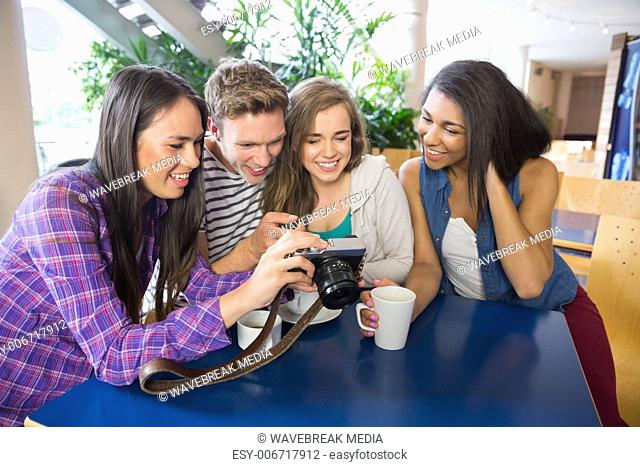 Young students looking at a camera