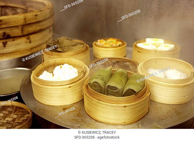Assorted dim sum in bamboo steamers Asia