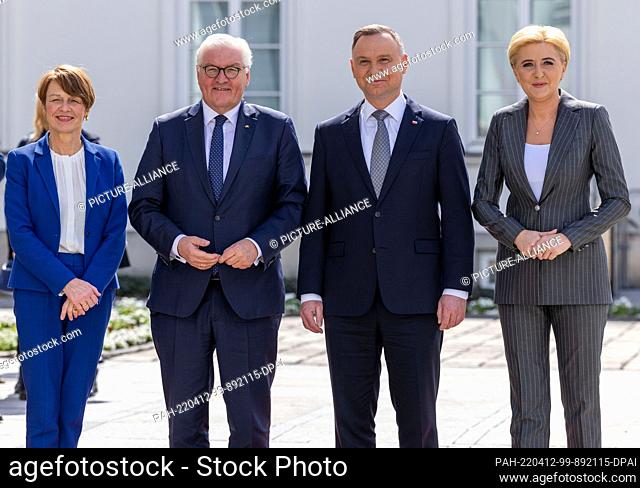 12 April 2022, Poland, Warschau: German President Frank-Walter Steinmeier (2nd from left) and his wife Elke Büdenbender (l) are welcomed by Polish President...