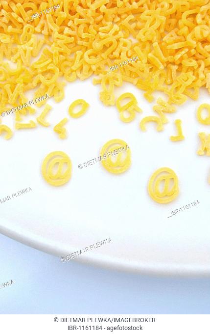 Letters made of pasta with special character @, plate