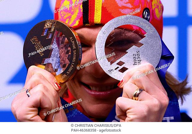 Silver medalist Maria Hoefl-Riesch of Germany, poses with her medal for Super-G (R) and her gold medal of the Women's Ski alpine Women's Super Combined during...
