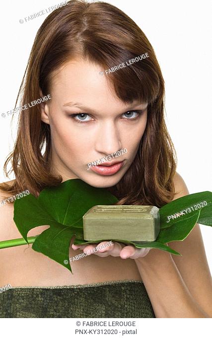 Young woman holding olive oil soap