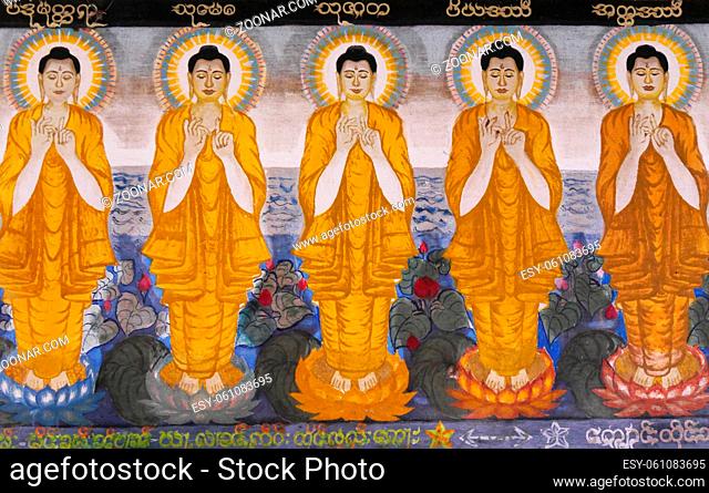 Temple painting in Hsipaw, northern Myanmar (Burma) showing a row of Buddha figures in yellow robes and golden aura. High quality photo