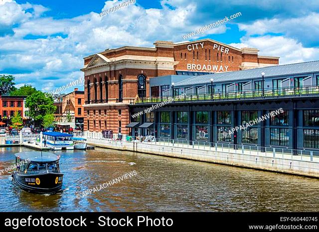 A water taxi and the historic Recreation Pier in Fells Point, Baltimore, Maryland
