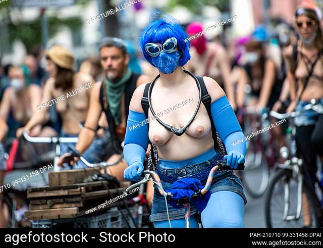 10 July 2021, Berlin: Participants of a bicycle demonstration ride through Berlin under the motto ""No Nipple is free until all Nipples are free! The...