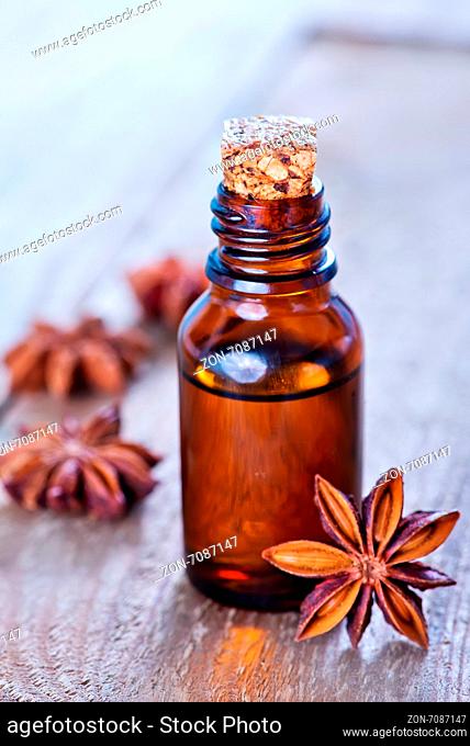 anise oil in bottle and on a table
