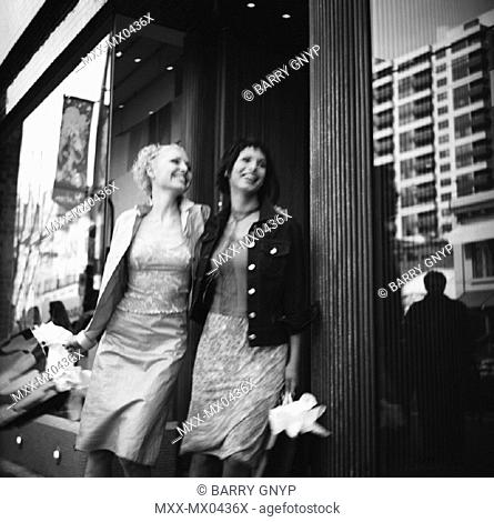 Two women shopping on Robson St., Vancouver, B.C