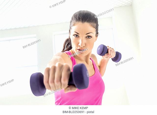 Caucasian woman lifting weights