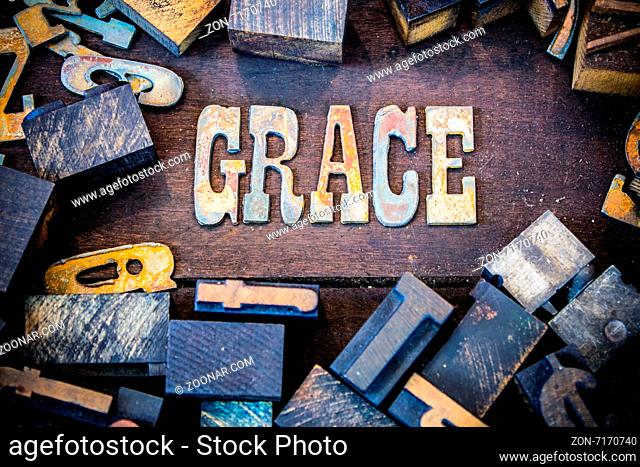 The word GRACE written in rusted metal letters surrounded by vintage wooden and metal letterpress type