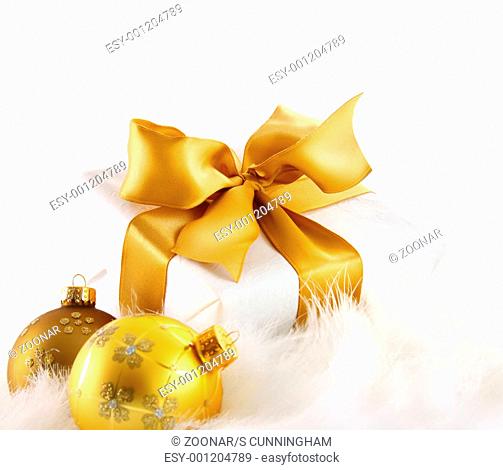 Gold ribbon gift on white