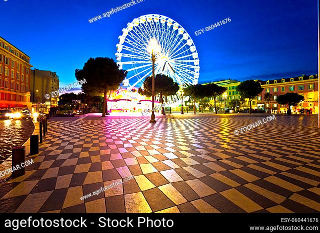 Nice giant ferris wheel and Massena square evening view, Alpes-Maritimes region of France