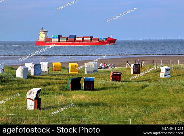 Grass beach with beach chairs and container ship at the Elbe estuary in the district Döse, North Sea resort Cuxhaven, Elbe estuary, North Sea, North Sea coast