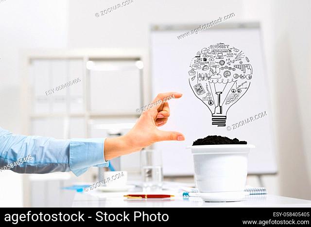Hand of business person measuring with fingers plan for income growth