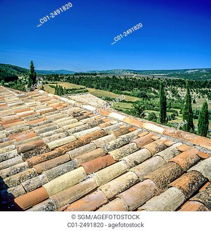 Curved tile roof in Aurel village and view of Sault valley, Vaucluse, Provence, France