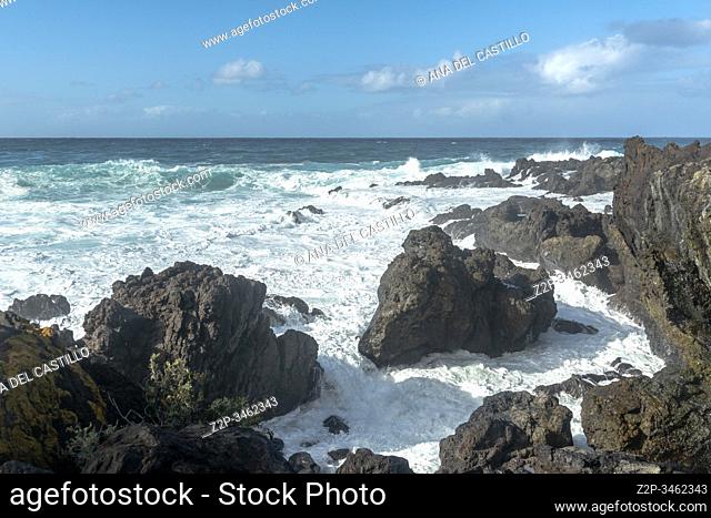 Foam waves on the rocky coast of Buenavista North of Tenerife island Spain