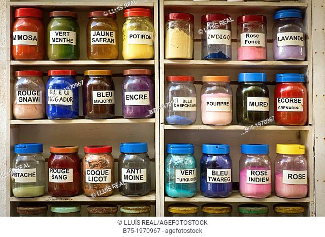 Shelf full of jars of dye colors