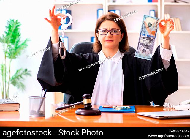 Middle-aged female doctor working in courthouse