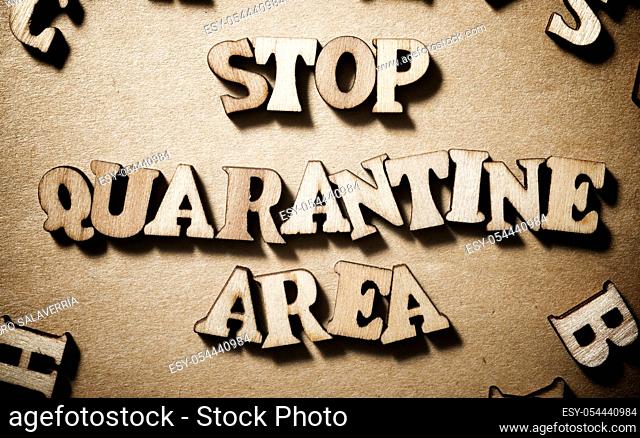 Stop Quarantine Area sentence on a brown paper