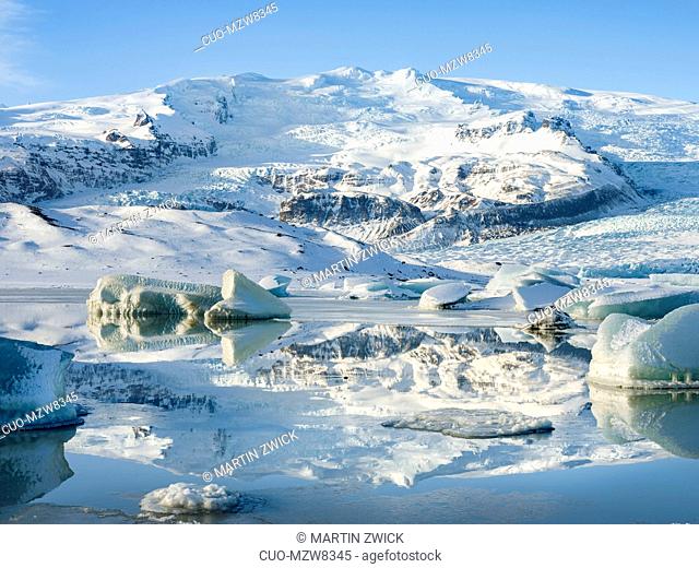 Glacier Fjallsjoekull and frozen glacial lake Fjallsarlon in Vatnajokull NP during winter. Europe, Northern Europe, Iceland, February