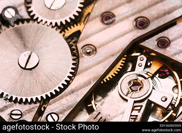 Old Retro Clockwork Background. Clock Watch Mechanism With Gray And Golden Gears. Vintage Mechanism With Movement Mechanics