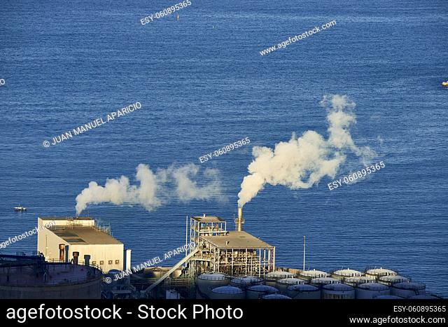 White smoke emissions from a company on the coast, Biscay, Basque Country, Euskadi, Euskal Herria, Spain, Europe