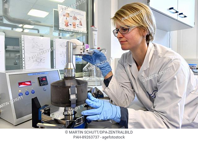 Chemical lab technician Petra Brauer controlls a product at the particle measuring device in a laboratory of the Aeropharm GmbH in Rudolstadt, Germany