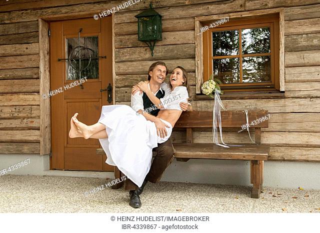Wedding couple in front of an alpine mountain hut