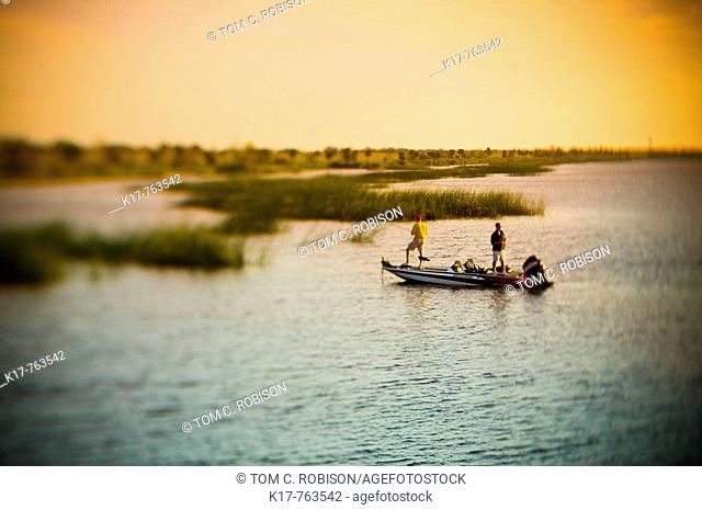 Sunrise Bass fishing on Lake Ochechobee, Florida USA baitcasting for bass from bassboat