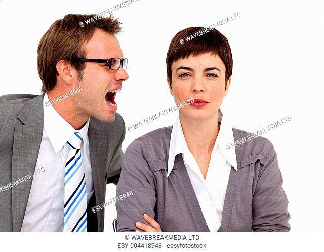 Angry businessman shouting into his colleague's ear