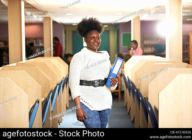 Portrait confident young female college student in computer lab