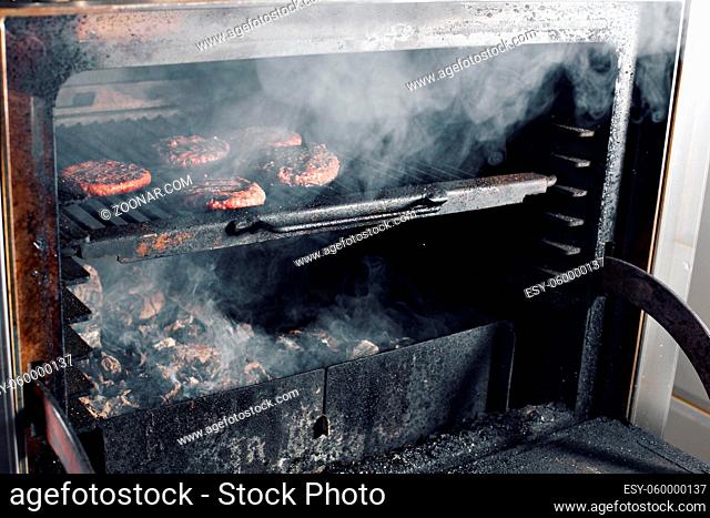 BBQ Grilled Burgers Patties On The Hot Flaming Charcoal Grill, Food, Good Snack For Outdoor Party Or Picnic