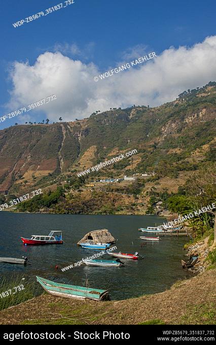 View of a bay with boats in the town of San Antonio on Lake Atitlan in the southwestern highlands of Guatemala