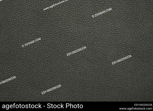 Close up background texture pattern of black natural leather grain, directly above