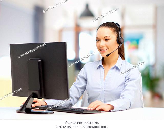 helpline operator in headset working at office