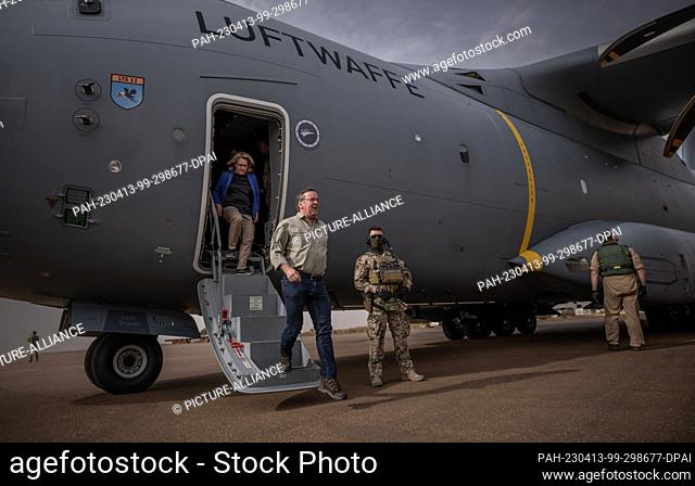 13 April 2023, Mali, Gao: Boris Pistorius (SPD), Minister of Defense and Svenja Schulze (SPD), Federal Minister for Economic Cooperation arrive at the airport...