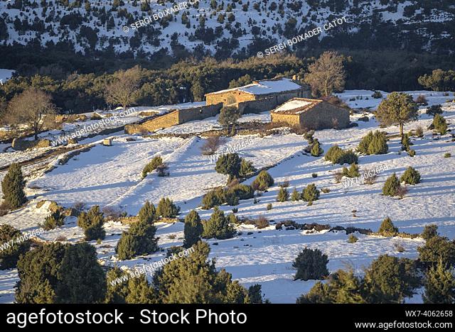 Rural scene in a winter sunrise, after a snowfall near Morella (province of Castellón, Valencian Community, Spain)